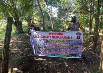 Bhabinkamtibmas Sosialisasikan Larangan Membakar Hutan dan Lahan