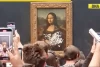 Lukisan Mona Lisa Dirusak oleh Pria yang Berpakaian Seperti Wanita